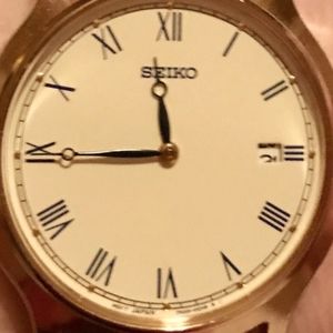 Seiko brown leather watch.